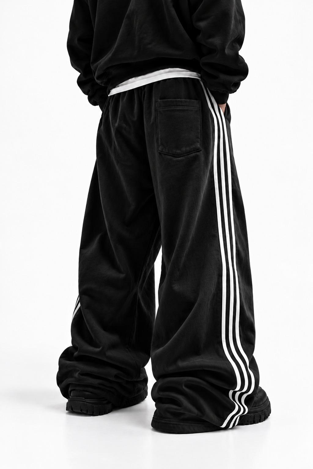 Drift Track Pants Obsidian, worn, back view, with the back patch pocket