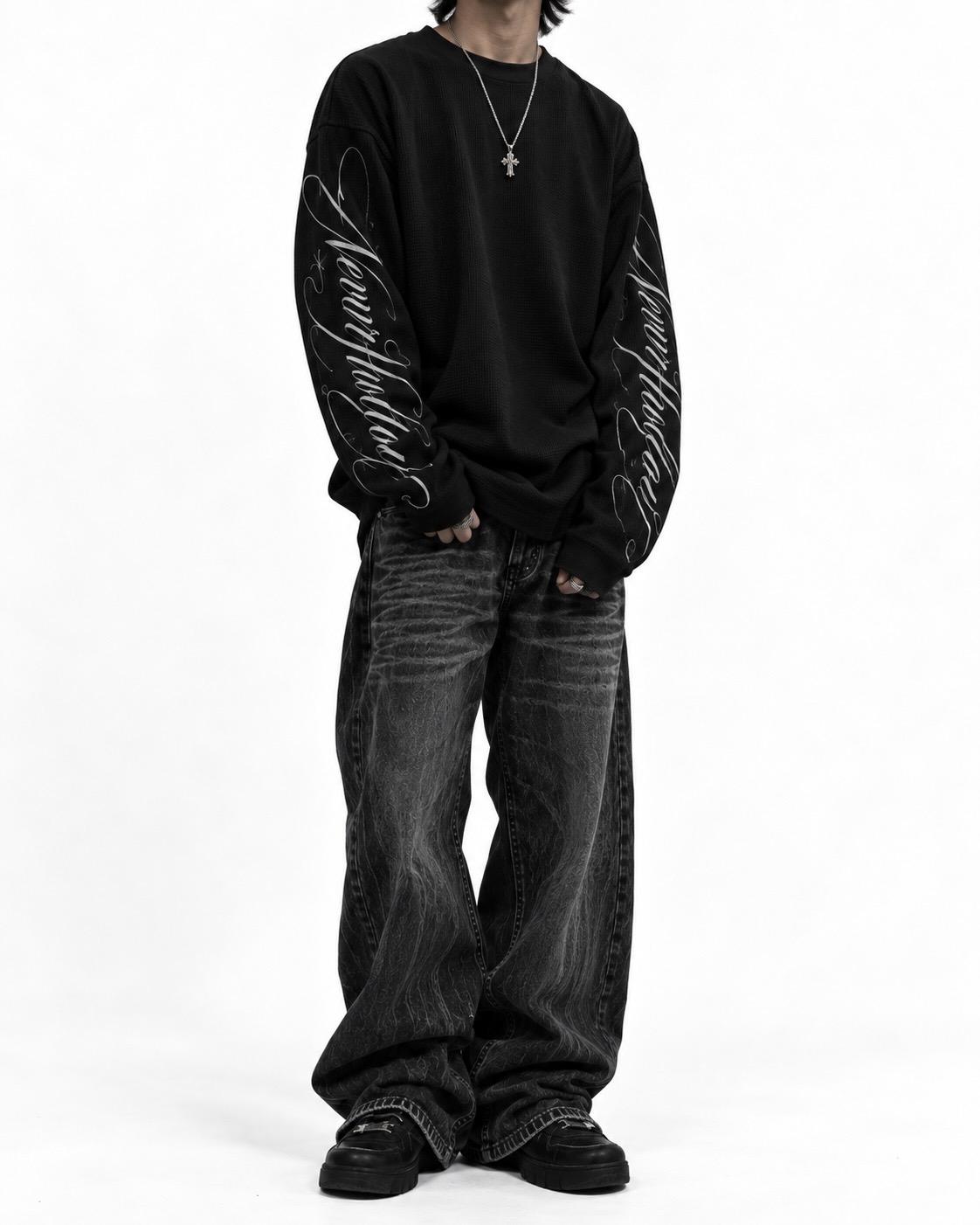 Vow Waffle Long Sleeve in black, worn, front view, with the Neverhollow script down both sleeves
